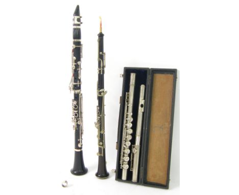 J.R. La Fleur & Sons metal flute, no. 6459, case; together with an ebonite clarinet and rosewood oboe (3) 