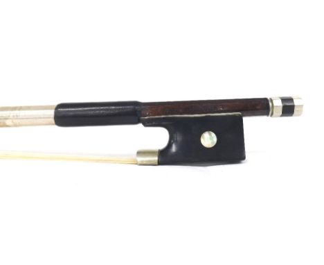 German nickel mounted violin bow stamped *Albert Nurnberger*, the stick round, the ebony frog inlaid with pearl eyes and the 