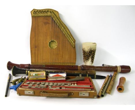 Quantity of various musical instruments and instrument parts to include a zither, small drum, a bass recorder, other recorder