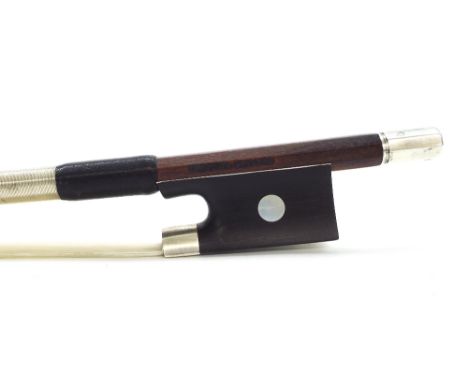 Good French silver mounted violin bow stamped Gustave Villaume, the stick round, the ebony frog inlaid with pearl eyes and wi