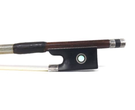 Good German silver mounted violin bow by and stamped *Albert Nurnberger*, the stick octagonal, the ebony frog inlaid with sil