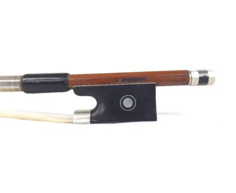 Silver mounted violin bow stamped J. Channing, the stick octagonal, the ebony frog inlaid with silver rings enclosing pearl e