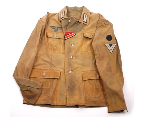 1939-1945 German Third Reich, Wehrmacht tropical tunic. With Signals sleeve patch and corporal rank insignia. A well used exa