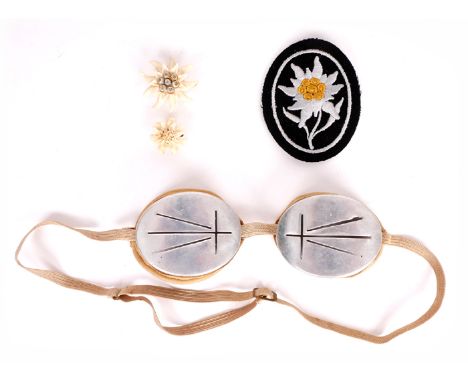 1939-1945 German Third Reich, Gebirgsjager snow goggles, arm patch and carved edelweiss. (4) A mountain trooper's pair of alu