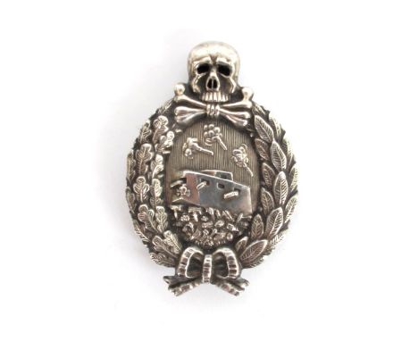 1914-1918 German Tank Combat badge. A white metal oval badge. a tank crossing a battlefield, surrounded by an oak-leaf and la