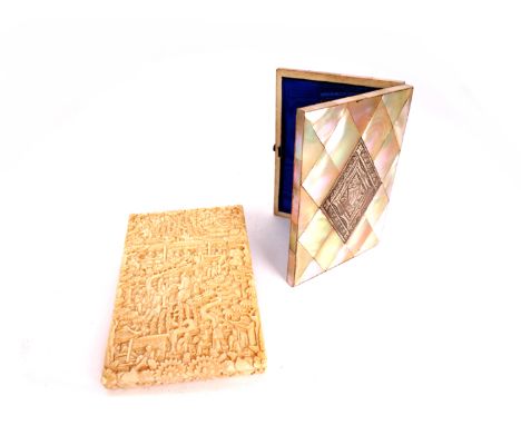 A carved ivory card case and a mother-of-pearl card case The Japanese ivory case carved with scholars in a garden, the nother