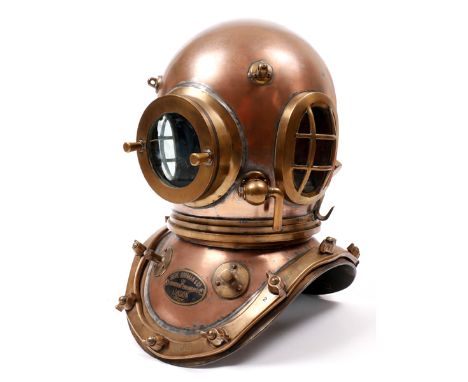 A Siebe Gorman twelve-bolt copper and brass diving helmet. A 12-bolt diving helmet by Siebe Gorman & Co, London:, the copper 