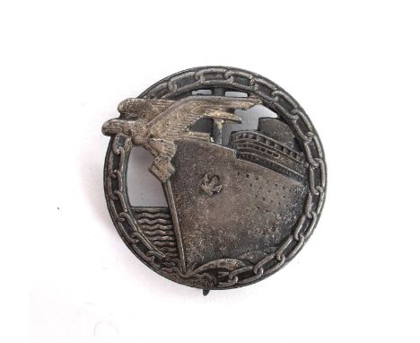 1939-1945 German Third Reich, Kriegsmarine Blockade Breaker's badge, silver and grey. An approaching grey coloured Merchant s