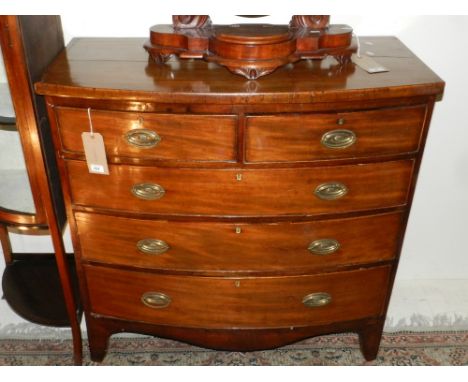 A George III bow-fronted chest of two short over three graduated drawers, raised on shaped bracket feet. H: 102cm D: 49cm W: 