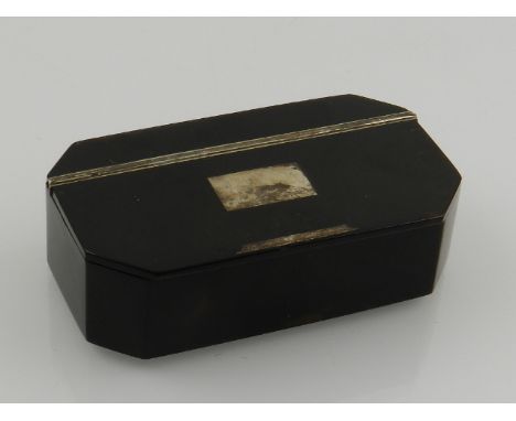 A 19th century tortoiseshell snuff box, rectangular with canted corners and a vacant white metal cartouche, W. 8cm