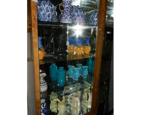 A collection of twelve various ceramic jugs and vases.
