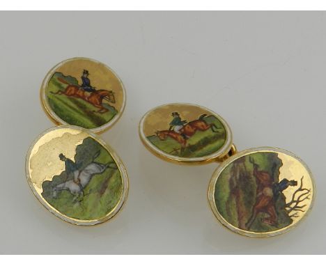 Of hunting interest. A pair of 18 carat yellow gold and enamelled cufflinks, depicting riders and horses over jumps. 