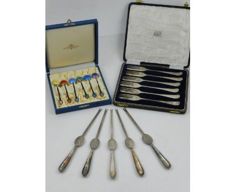 A cased set of six silver and enamel teaspoons, a cased set of silver plated forks, and five plated marrow spoons.