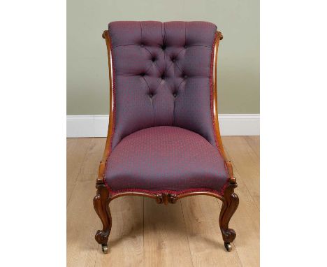 A Victorian mahogany framed low occasional chair with button upholstered back and carved cabriole front legs, 55cm wide x 90c