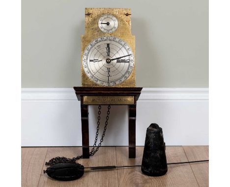 A reproduction time piece of the Benjamin Franklin clock of 1757, the plate numbered' 613', on a wooden bracket, 18cm wide x 