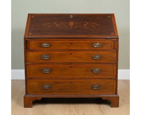 A 19th century mahogany bureau, the fall front with decorative inlay eclosing a fitted interior with drawers and pigeon holes
