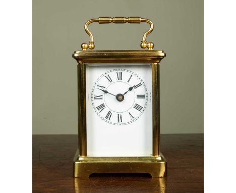 Brass carriage timepiece with enamel dial, 14cm high with the handle upClean condition, dent to the front foot, and further m