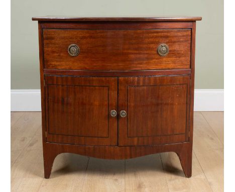 A 19th century mahogany bow fronted converted commode with a single drawer over twin cupboard doors and on bracket feet, 76cm