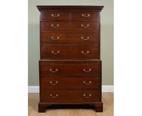 A 19th century mahogany chest on chest, with two short and three long drawers to the upper section, and a slide and four long