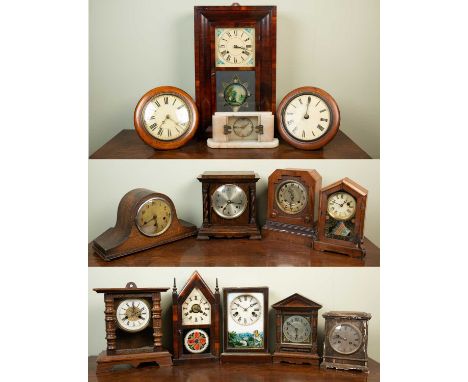 A group of 13 various wall and mantle clocks, American and Continental, to include two postman's alarm clocks; an American og