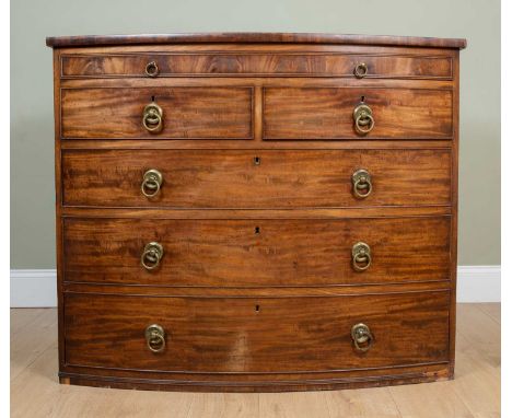 A 19th century bow fronted chest of drawers with later brass ring handles, 126cm wide x 63cm deep x 105.5cm high

Lacking fee