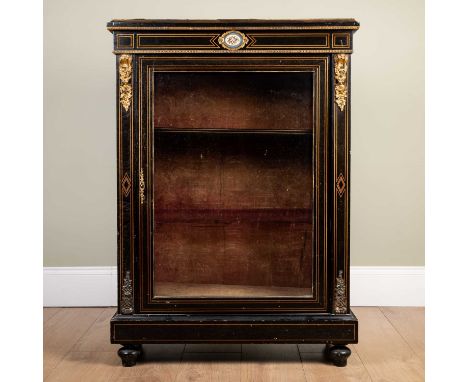 A Victorian ebonised pier cabinet, with satinwood inlay, and ormolu mounts and beading, and centralized painted ceramic medal