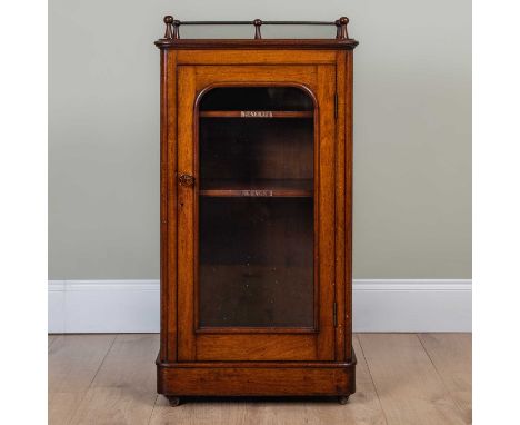 A victorian mahogany music cabinet, with galleried top, glazed door and two labelled shelves within for 'Songs' and 'General'