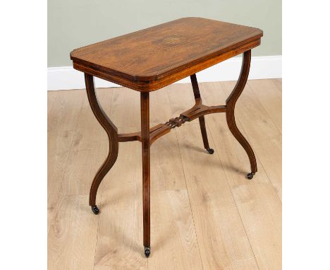 An Edwardian rosewood and inlaid occasional table, the rectangular top with rounded corners, on shaped legs united by stretch