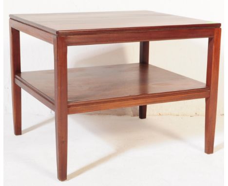 A retro vintage mid 20th century circa. 1970s two tier dark teak coffee table in a Richard Hornby manner. With lower magazine