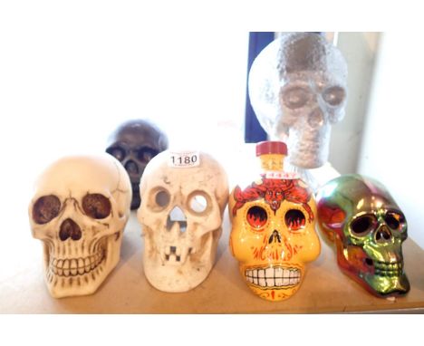 Five modern skull ornaments and a Dia de los Muertas decanter. P&amp;P Group 3 (£25+VAT for the first lot and £5+VAT for subs