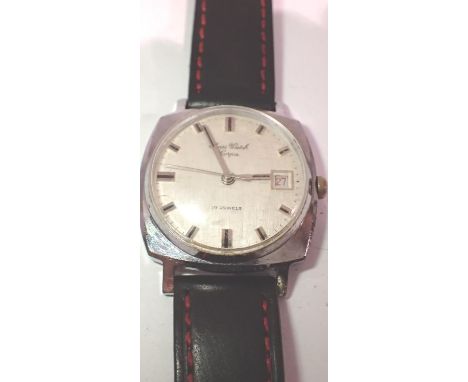 SWISS WATCH COMPANY: gents steel cased manual wind wristwatch, with date aperture, circular brushed silvered dial on a red-st