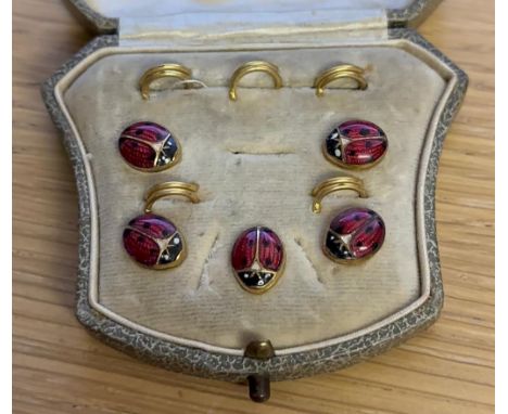 Boxed set of five enamel and gilt studs. P&amp;P Group 1 (£14+VAT for the first lot and £1+VAT for subsequent lots) 
