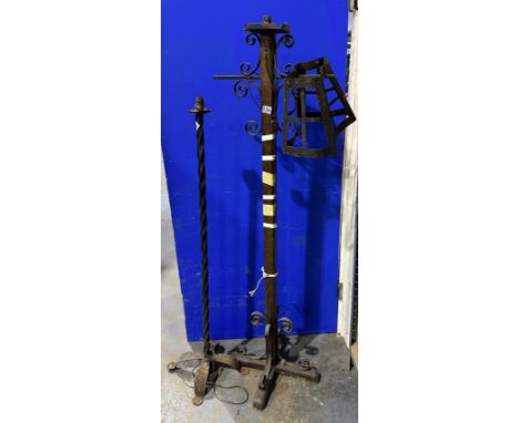 Standard lamp with oak stem and wrought iron fixtures, and a further wrought iron example. Not available for in-house P&amp;P