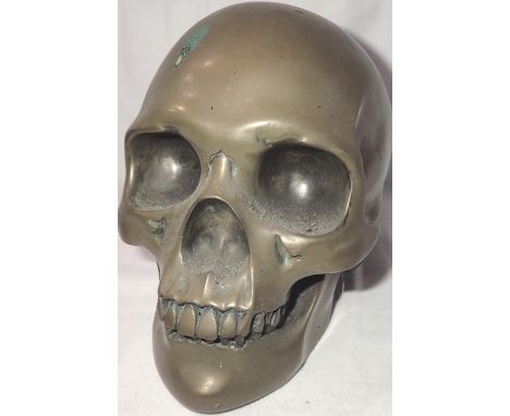 Bronzed skull by Spellow House, H: 16 cm. P&amp;P Group 2 (£18+VAT for the first lot and £3+VAT for subsequent lots) 