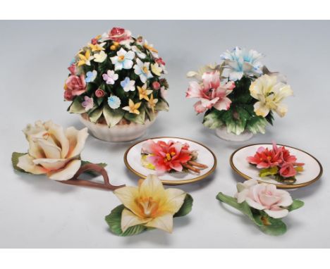 A group of vintage 20th Century Capodimonte ceramic flower ornaments of varying colours, two within baskets as flower arrange