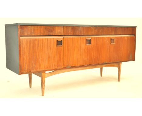 A 1960's EON Elliots Of Newbury&nbsp; retro vintage teak wood sideboard credenza having three drawers above a central shelved