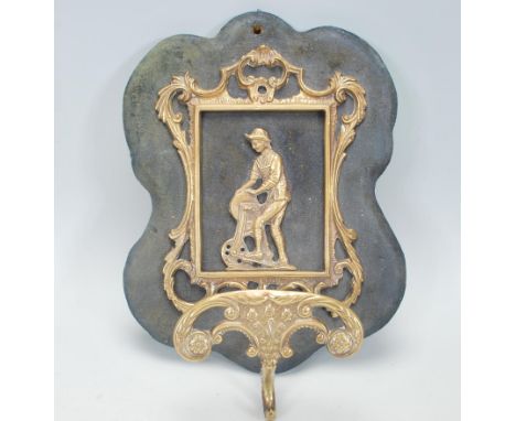 A 19th century Victorian brass hat and coat stand being of scroll work design&nbsp; with figural scene of man and mill to cen