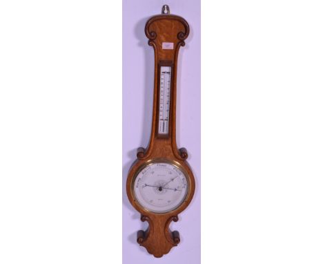 An early 20th century Botly &amp; Lewis of Reading oak wall barometer. The heavy thick banjo barometer having silvered dial a