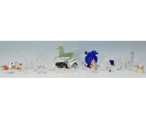 A collection of mixed miniature glass figures to include a crystal glass orb raised on a gilt base, Christmas tree with colou