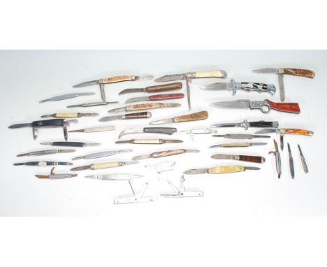 A collection of pocket knives of varying sizes and designs to include a Good Year advertising example, Black Bear made in Kor