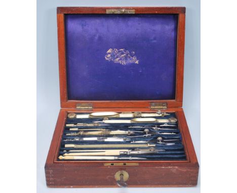 A late 19th Century wooden cased draughtsman set having a fitted blue velvet lined interior complete with draughtsman tools, 