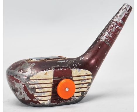 A vintage 20th Century table lighter in the form of a golf club head having push button side. Measures 9cm tall by 11cm wide.