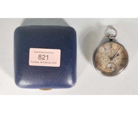 A 19th Century silver Victorian open faced pocket watch having an engine turned back with a central cartouche panel to the ba