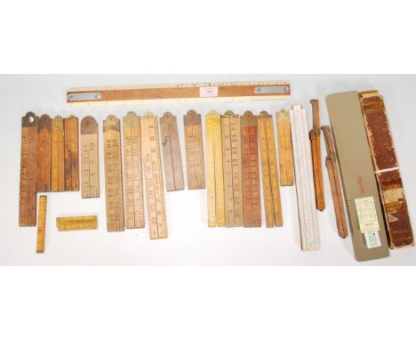 A good selection of vintage rules dating from the early 20th \Century to include multiple Rabone Boxwood examples to include 