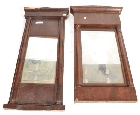 A near pair of 19th century continental Biedermeier wall mirrors. Each with half column uprights with flared pediments having