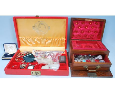 A collection of vintage costume jewellery to include a Coalport floral pin, a selection of fashion jewellery necklaces, a sel