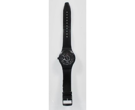 A Swatch Swiss Automatic wrist watch having a black face with a satellite design dial and date aperture to three, having an e