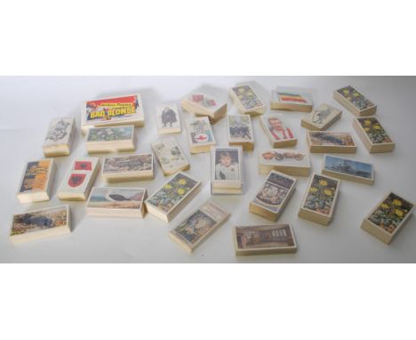 A collection of vintage cigarette and tea trade cards in mostly complete bundles. Sets include Wills Lucky Charms and Wild Fl
