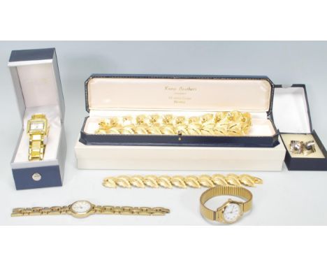 A selection of vintage ladies fashion jewellery to include a 1960's gold tone leaf necklace, three gold tone cocktail watches