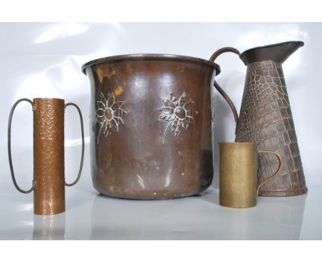 A selection of Arts and Crafts early 20th Century copper wares to include a Joseph Sankey &amp; Sons pitcher of tapering form